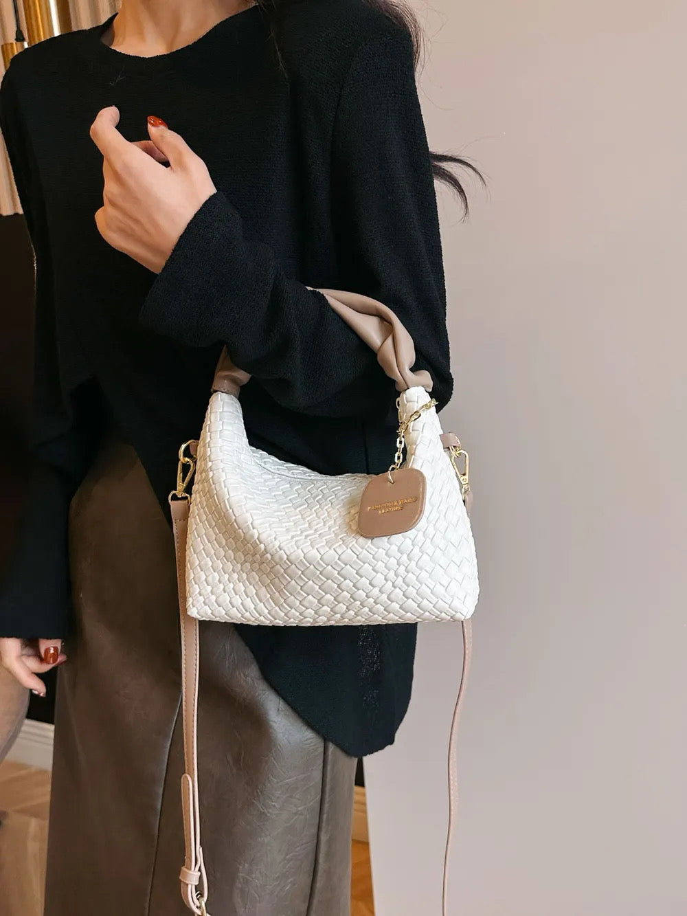 Woven crossbody leather handbag
