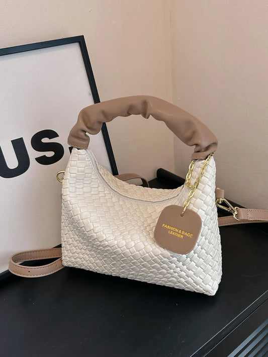 Woven crossbody leather handbag
